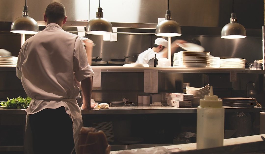 a restaurant kitchen with an owner who is wondering if they have enough restaurant insurance