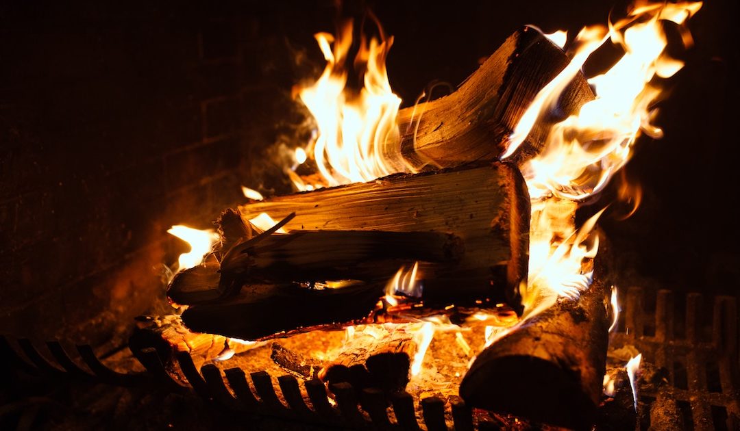 a roaring fire in the home of someone who should follow our fireplace safety tips